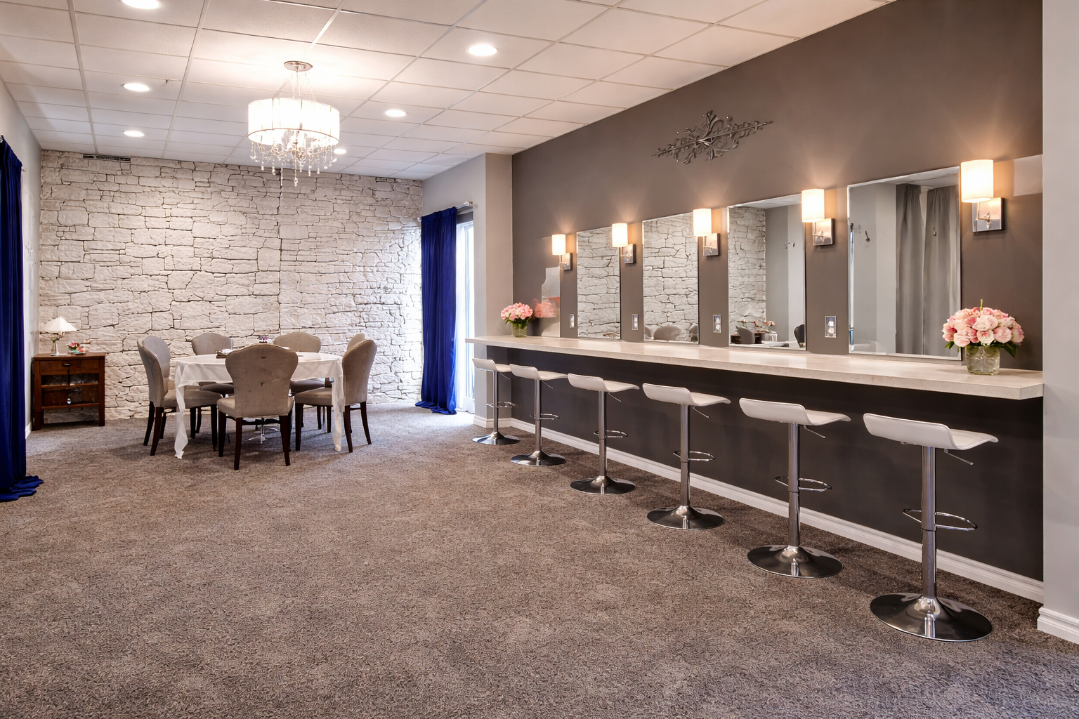 Bridal suite with vanity mirrors, salon seating, and lounge table