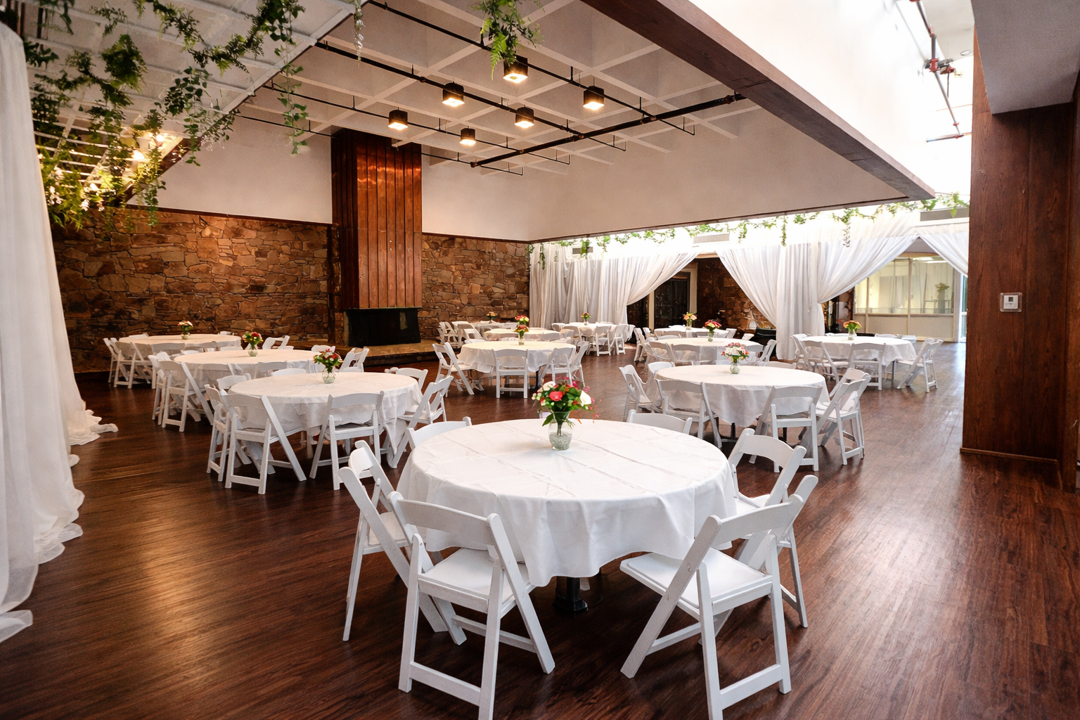 A candlelit reception setup inside Oasis Grand Hall